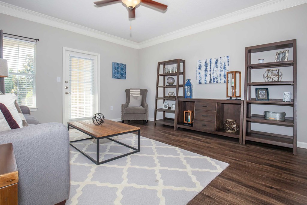 a living room with a couch and a coffee table at Carrington Place at Wildewood, Columbia, SC  