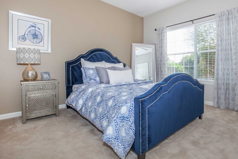 a bedroom with a bed and a window at Carrington Place at Wildewood, Columbia, SC 29223