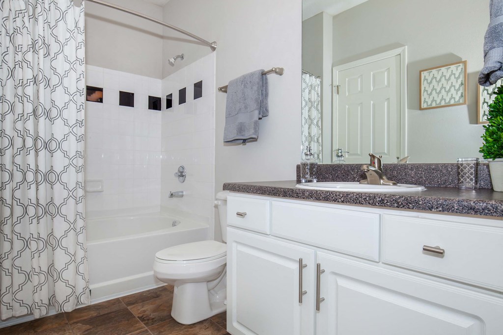 a bathroom with a shower and a toilet and a sink at Carrington Place at Wildewood, South Carolina   