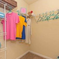 Clothes hanging on a clothesline in a room.