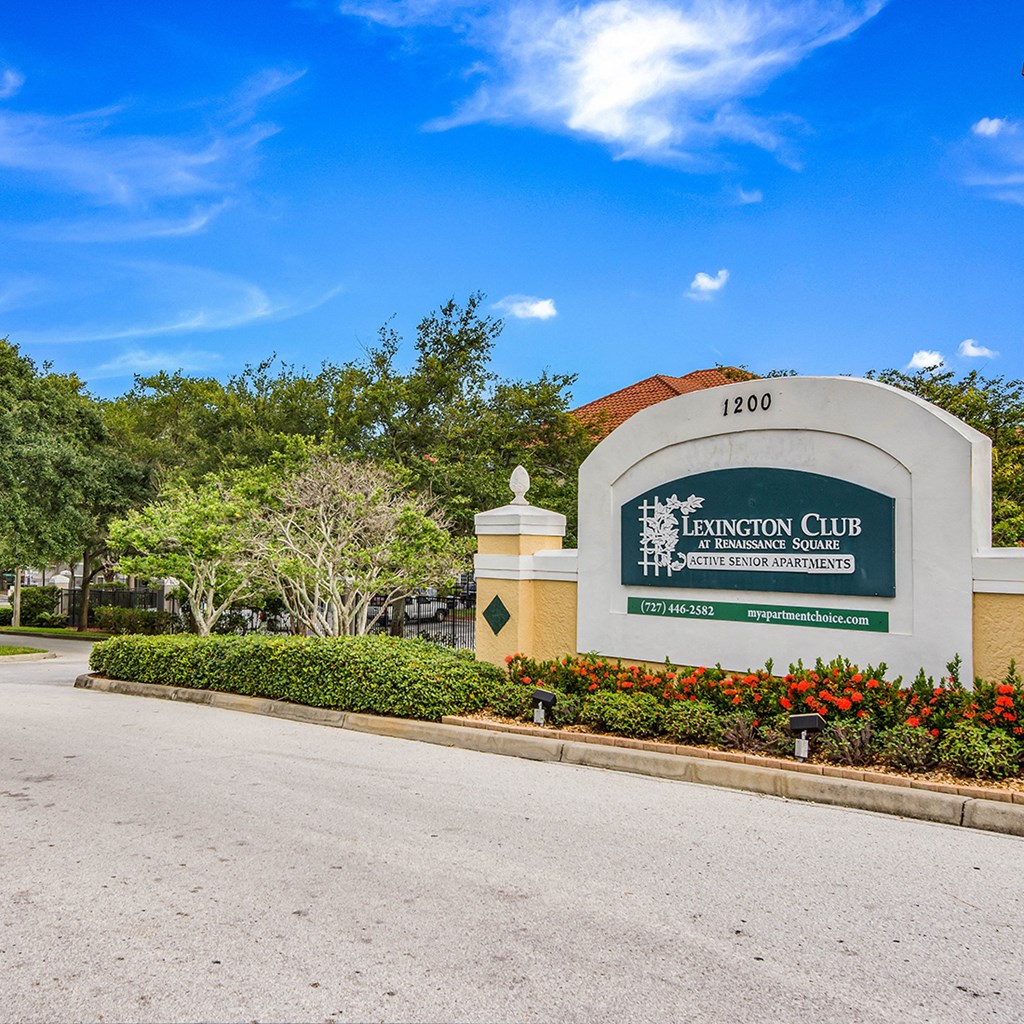 a picture of the entrance to the fenton club with trees in the background
