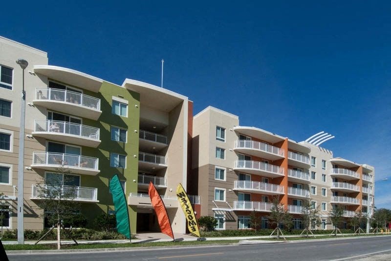 an apartment building on the side of a street
