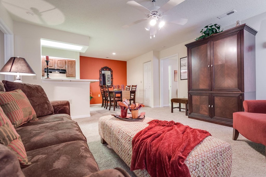 a living room with a couch and a chair at Arbors at Windsor Lake, Columbia  