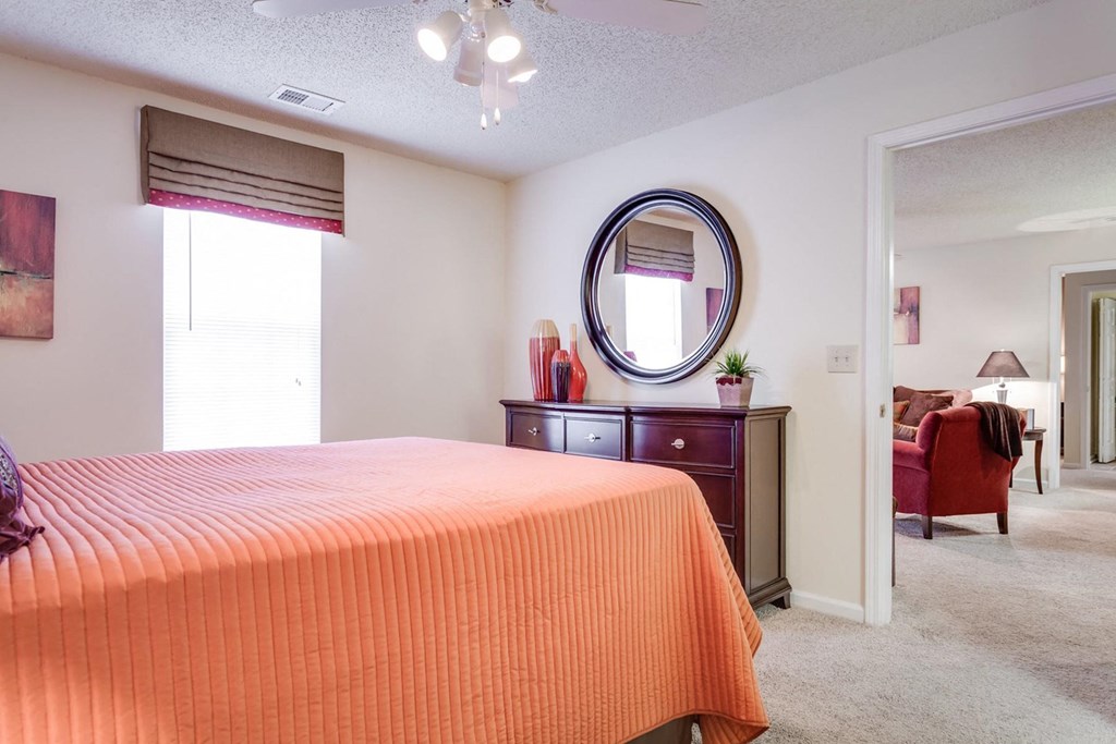 a bedroom with a bed and a mirror at Arbors at Windsor Lake, Columbia, 29223  