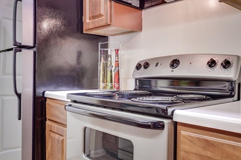 a kitchen with a stove and a refrigerator