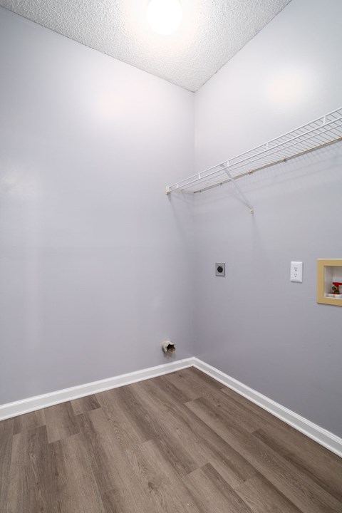 a bedroom with gray walls and a white ceiling