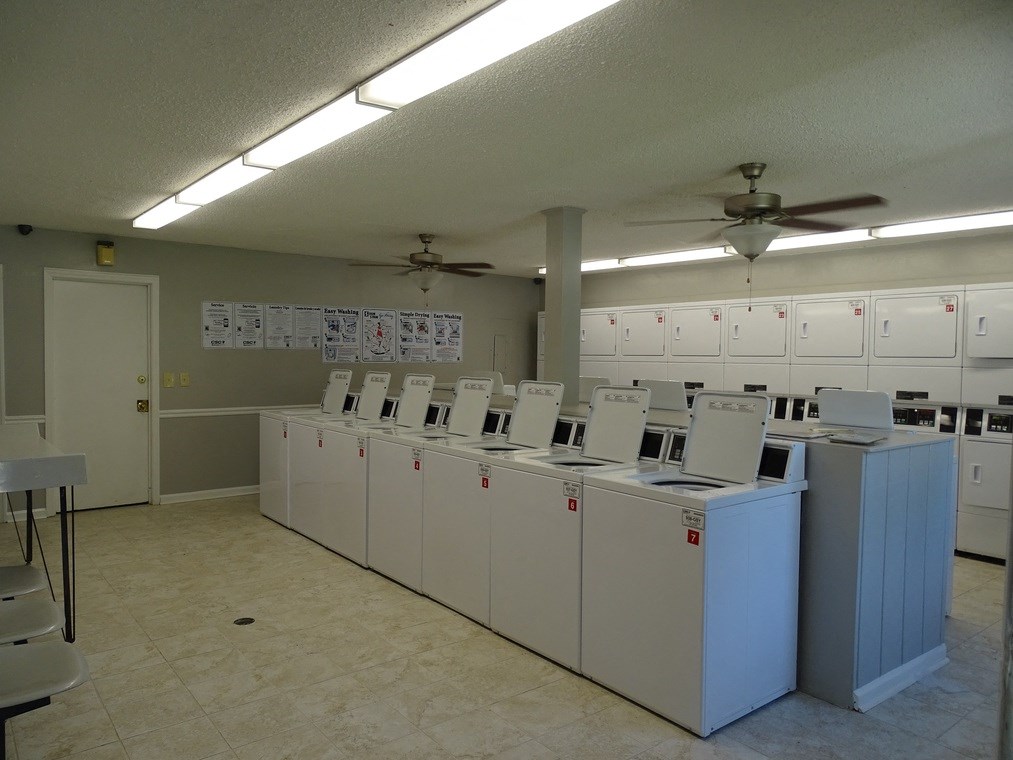 a laundry room with rows of washers and dryers at Brandywine Townhomes, Goose Creek, 29445  