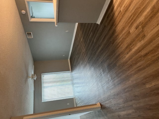 a bathroom with a shower and a window
