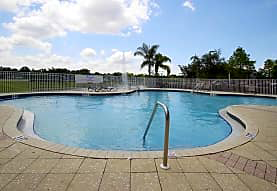 a large pool with a fence around it