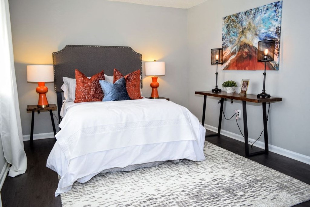a bedroom with a bed and two night stands with lamps a bedroom with a bed and two night stands with lamps at Brandywine Townhomes, Goose Creek South Carolina