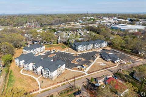 A large building with a parking lot in front of it.