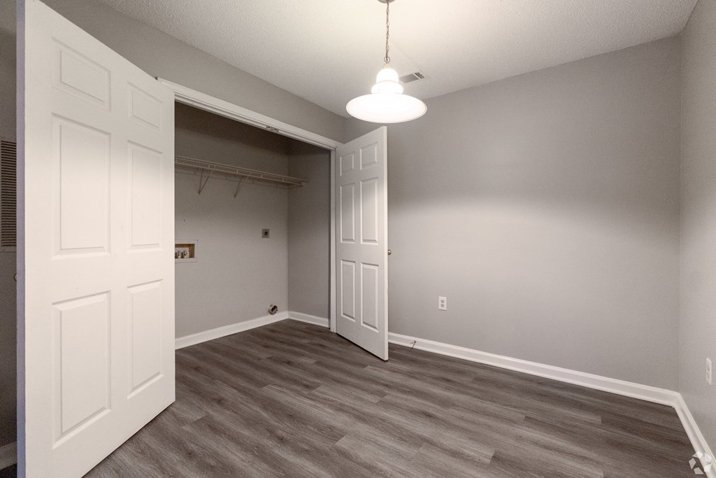 an empty bedroom with a closet and a door to the bathroom at Avon Crossings, North Carolina