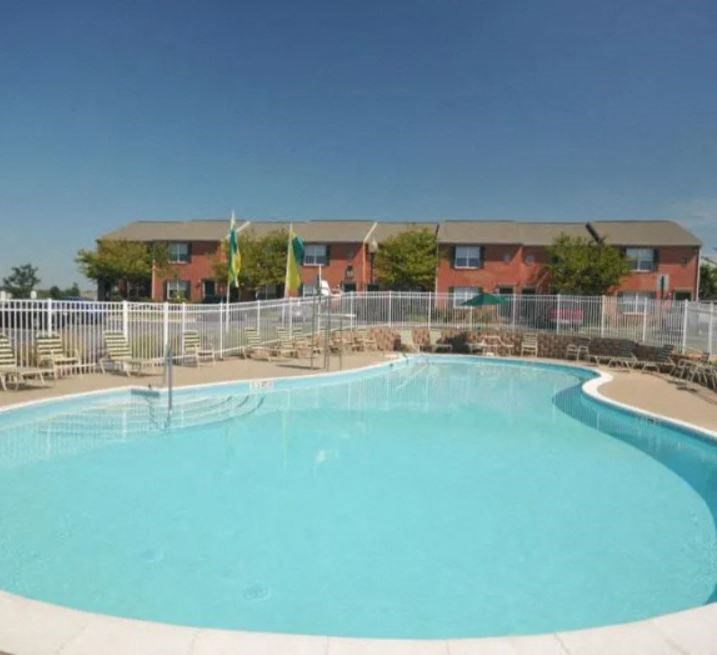 a large swimming pool with a building in the background at Crescent Pointe, Virginia, 22554