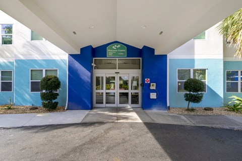 The entrance to a building with a blue and white color scheme.