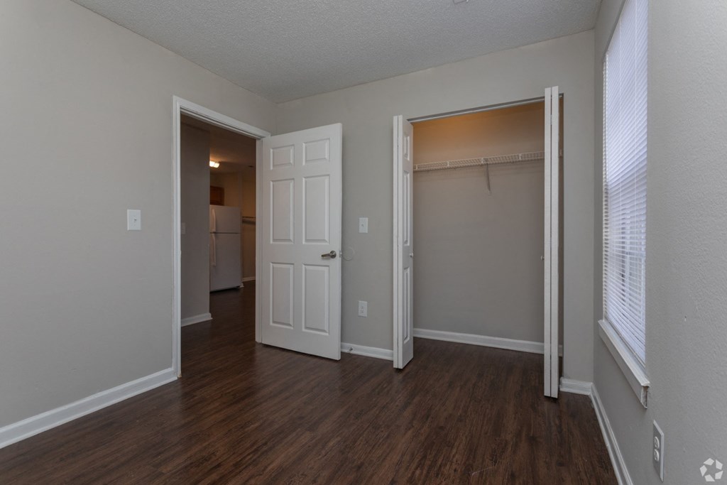 an empty living room with a closet and a window at Canaan Pointe, South Carolina, 29607