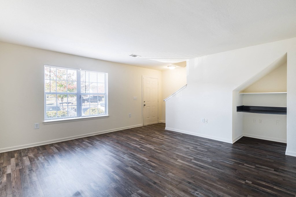 an empty living room with hard wood floors and a window at Crescent Pointe, Virginia, 22554