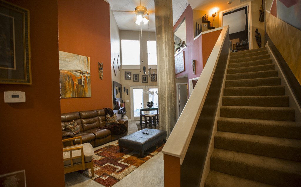 a view from the bottom of the stairs looking into the living room
