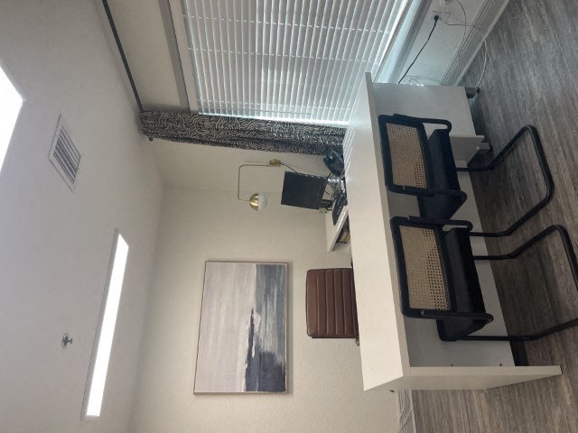 an overhead view of a living room with a staircase