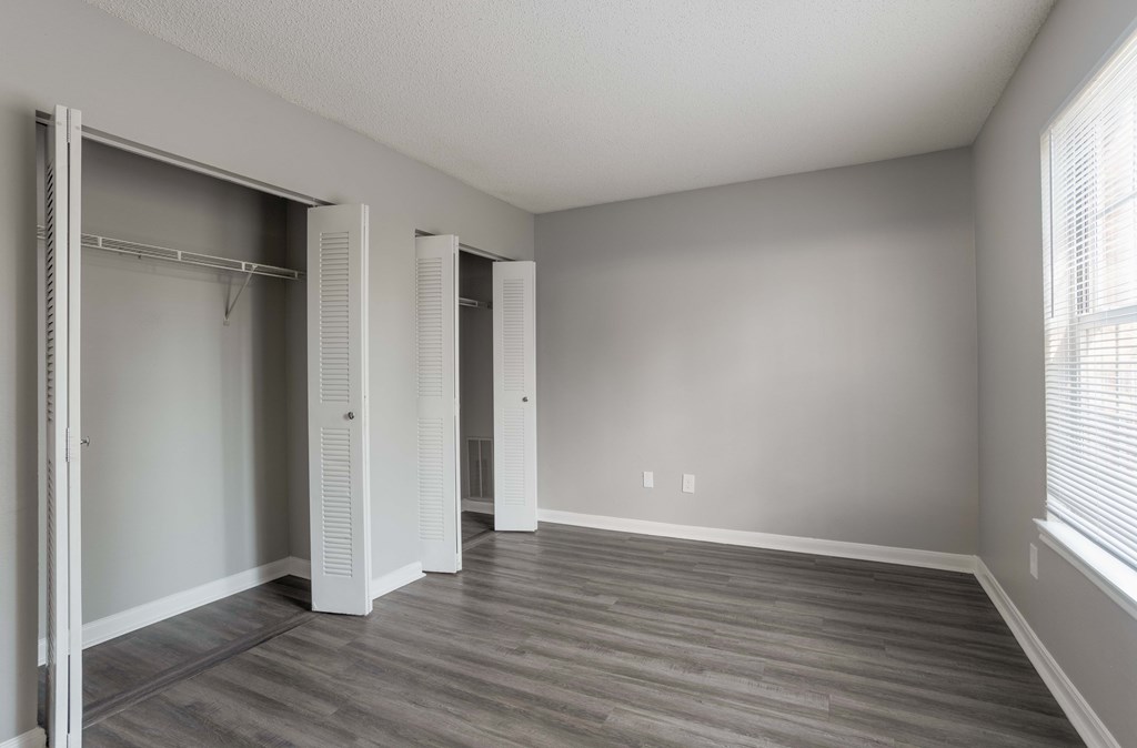 A room with a grey floor and white walls.