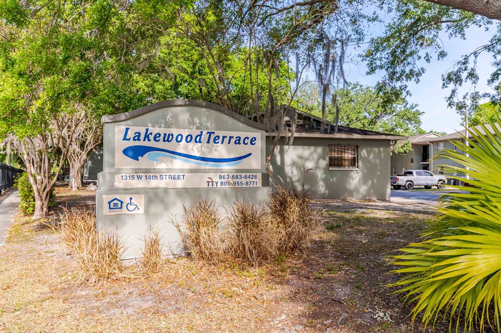 A sign for Lakewood Terrace with a wheelchair symbol indicating accessibility.