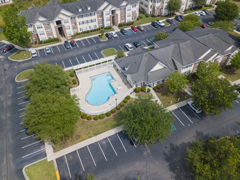an aerial view of the resort style pool and hot tub at the enclave at woodbridge apartments at Palms on Ashley River Apartments, Ladson, South Carolina