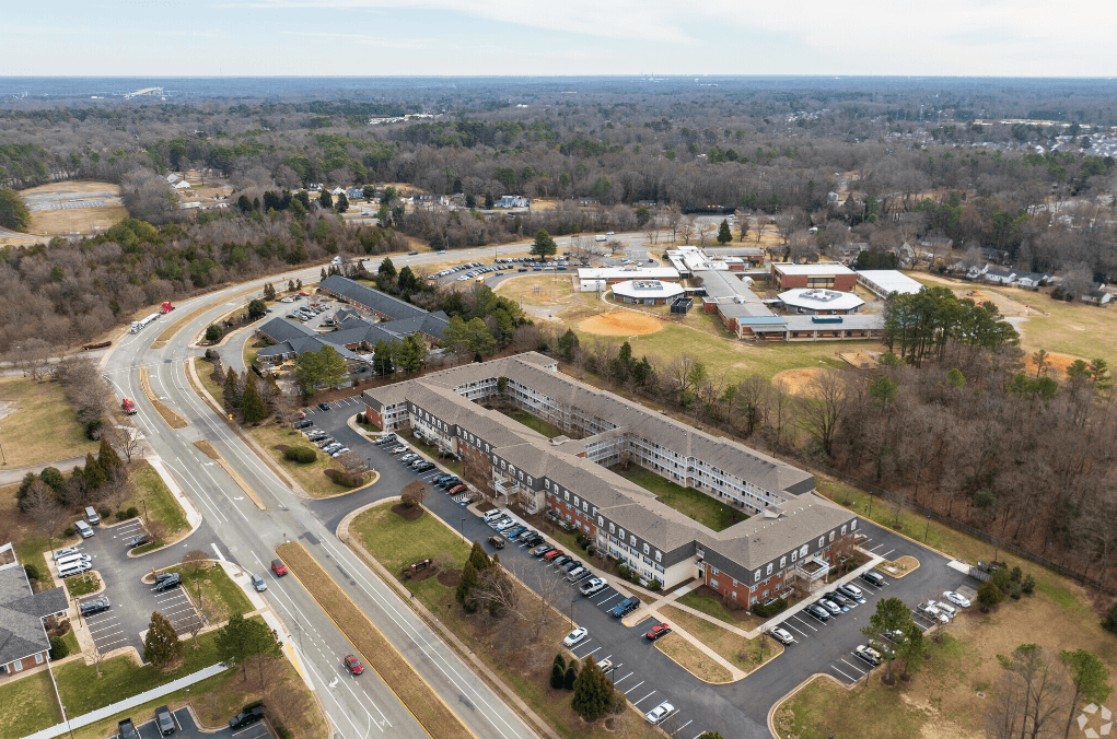 an aerial view of an office building and parking lot