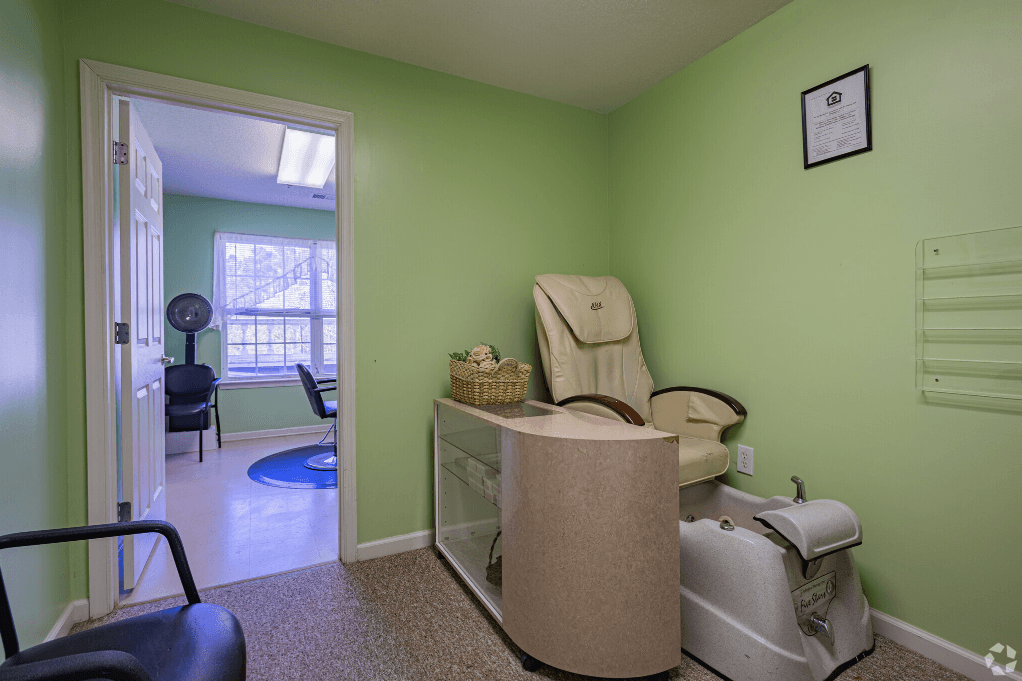 a dental room with a chair and a basket in it