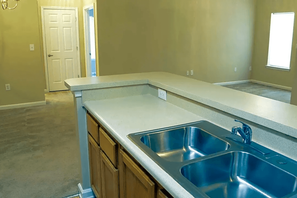 a kitchen with a stainless steel counter top and a sink