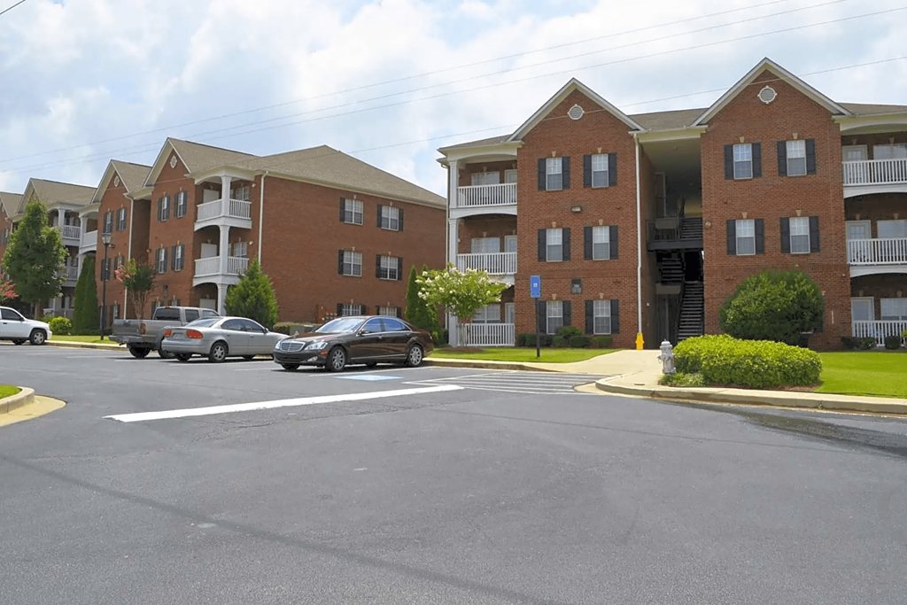 an empty street in front of an apartment building