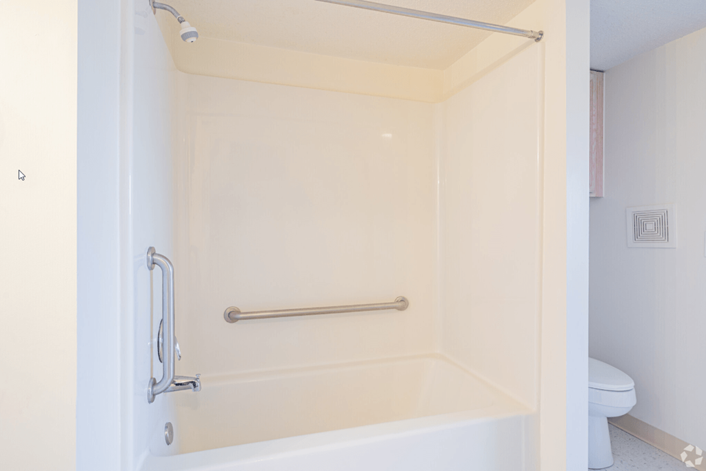 a bathroom with a shower and a toilet in it