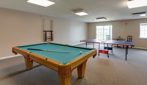 a game room with a pool table and two ping pong tables at River Run, Woodbridge  