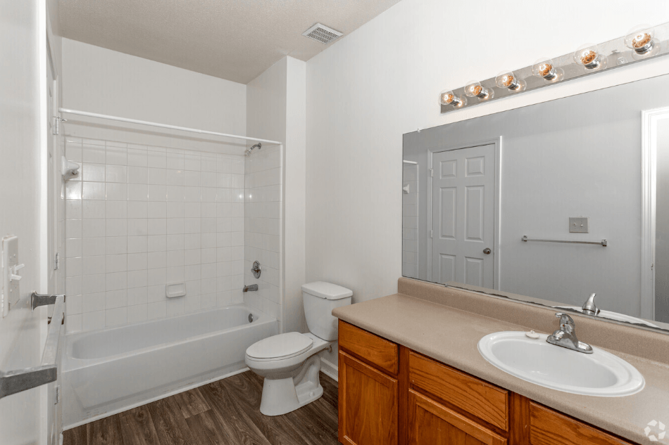 a bathroom with a sink toilet and a shower