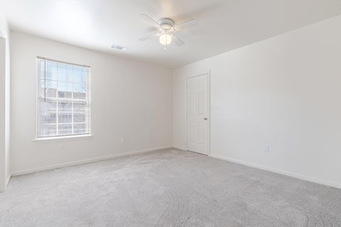 an empty bedroom with white walls and a ceiling fan an empty bedroom with white walls and a ceiling fan at Waterford at Sterling Place Apartments, Lancaster