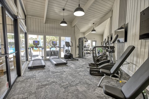 spacious fitness center with treadmills and other exercise equipment at Dwell at Greenridge, North Charleston, 29406