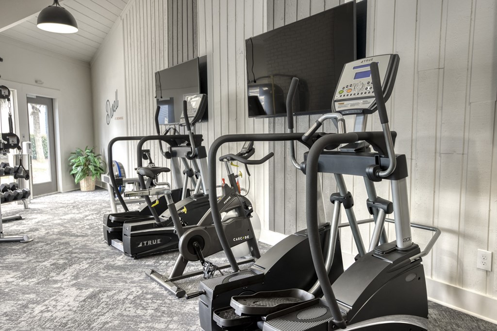 Gym with treadmills and elliptical machines Gym with treadmills and elliptical machines at Dwell at Greenridge, North Charleston