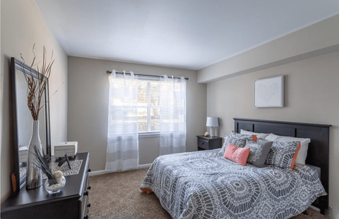a bedroom with a large bed and a large window at Bradley Square, South Carolina, 29406