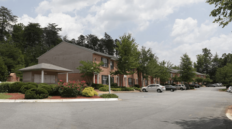 a street view of a building with cars parked in front of it at Brookside Pointe, Travelers Rest South Carolina