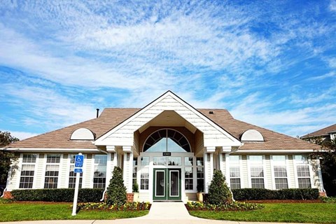 A building with a blue sign in front of it.