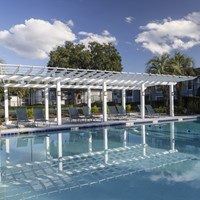 A pool with a white roof and a glass bottom.