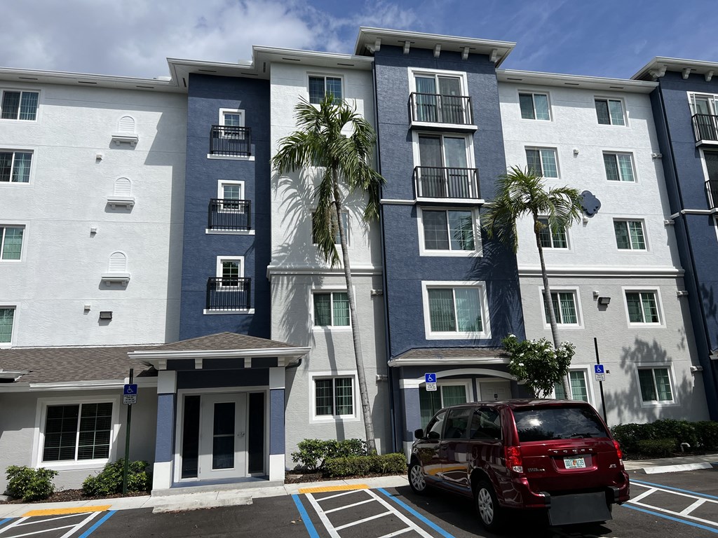 a van parked in front of an apartment building