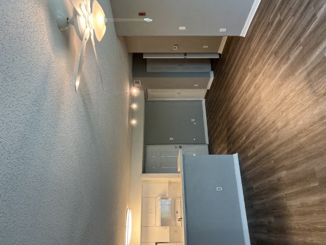 a kitchen with a refrigerator and a microwave