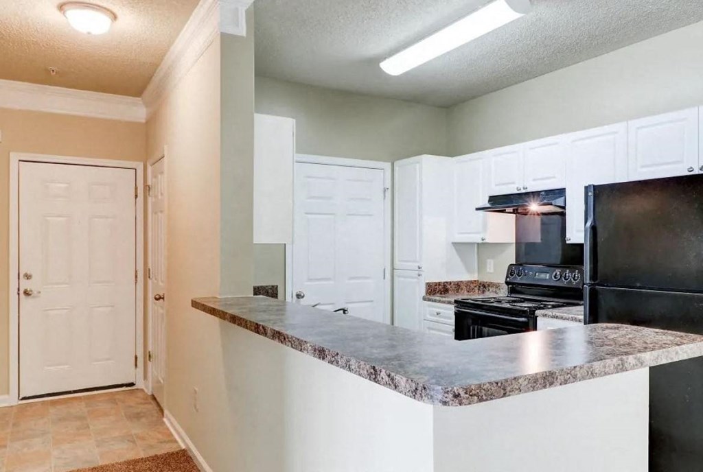 a kitchen with an island and a stove