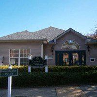 A house with a sign in front of it that says "Private Residence Parking".