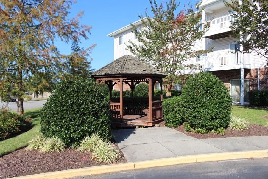 a gazebo in a yard in front of a house at Greenbrier Seniors Apartments, Chesapeake, 23320  