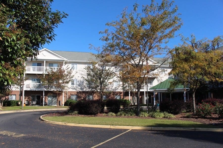 an empty street in front of an apartment building at Greenbrier Seniors Apartments, Virginia, 23320