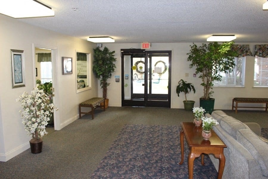 a living room with a couch and a coffee table at Greenbrier Seniors Apartments, Chesapeake, Virginia  