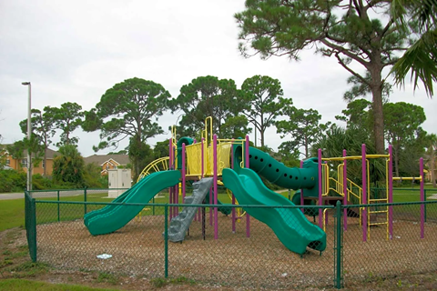 a playground with slides at a park
