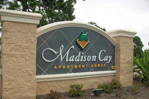 a sign at the entrance apartment lodges