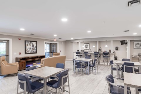 A spacious dining area with a variety of chairs and tables.