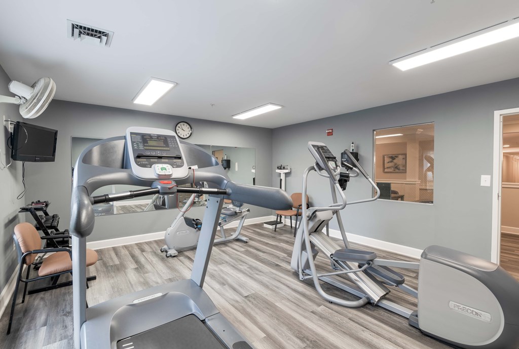 Gym with treadmills, elliptical machines, and other exercise equipment at Gardens of Traville, Rockville, MD, Maryland